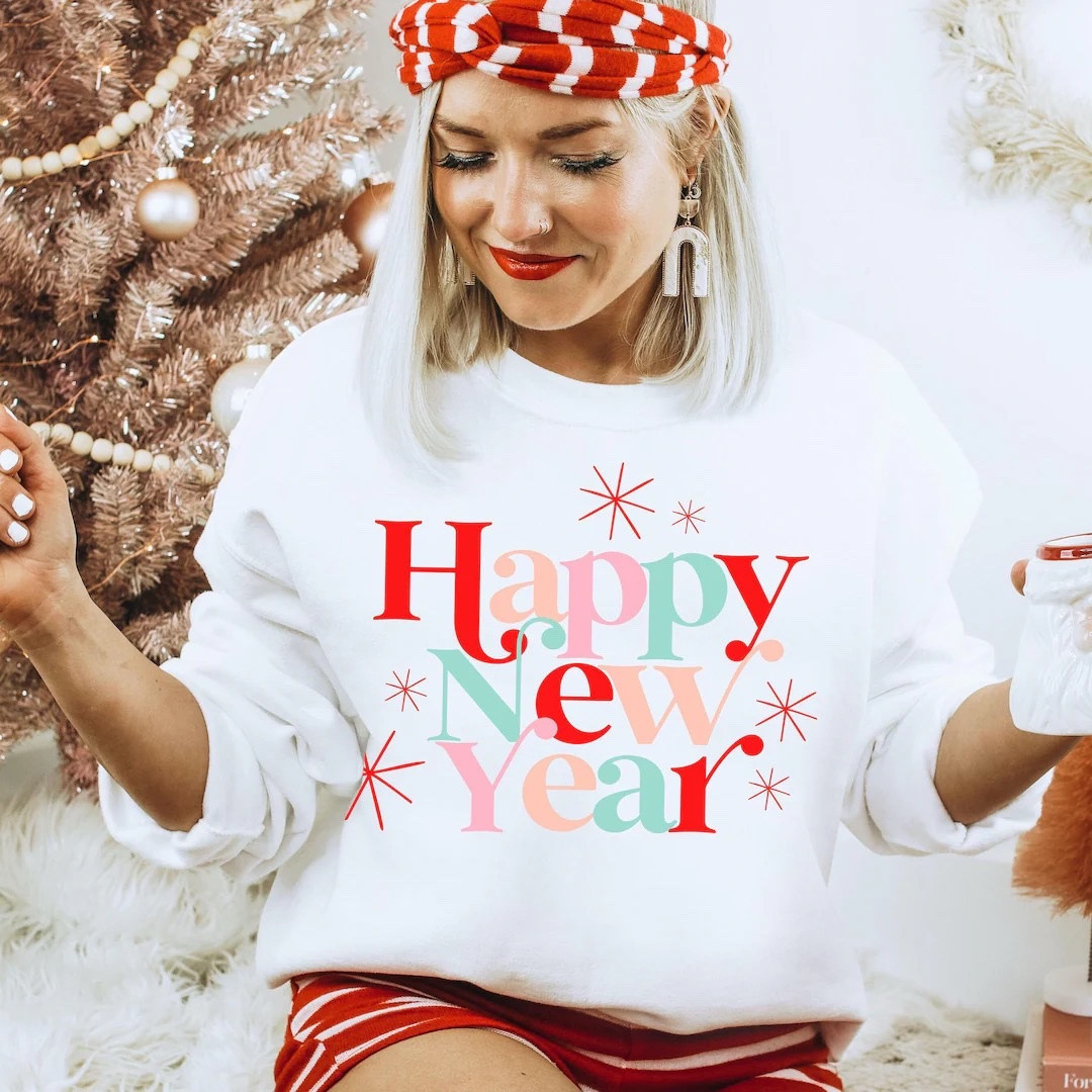 Happy New Year Sweatshirt: Holiday Style, New Year's Eve Shirt, Festive Party Outfit, Etsy sweatshirt 

#LTKHoliday #LTKSeasonal #LTKGiftGuide