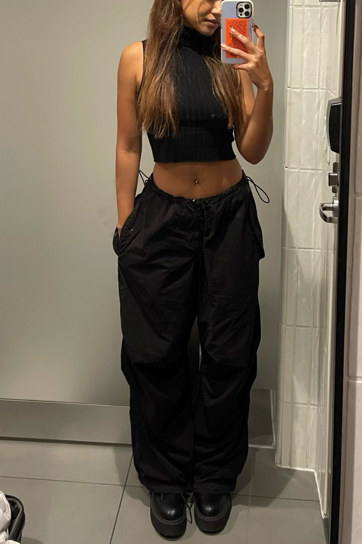 never thought i’d be pairing combat boots with cargos but here we are and we lot look GOODT 🖤top is old from H&M

#LTKstyletip #LTKunder100 #LTKSeasonal