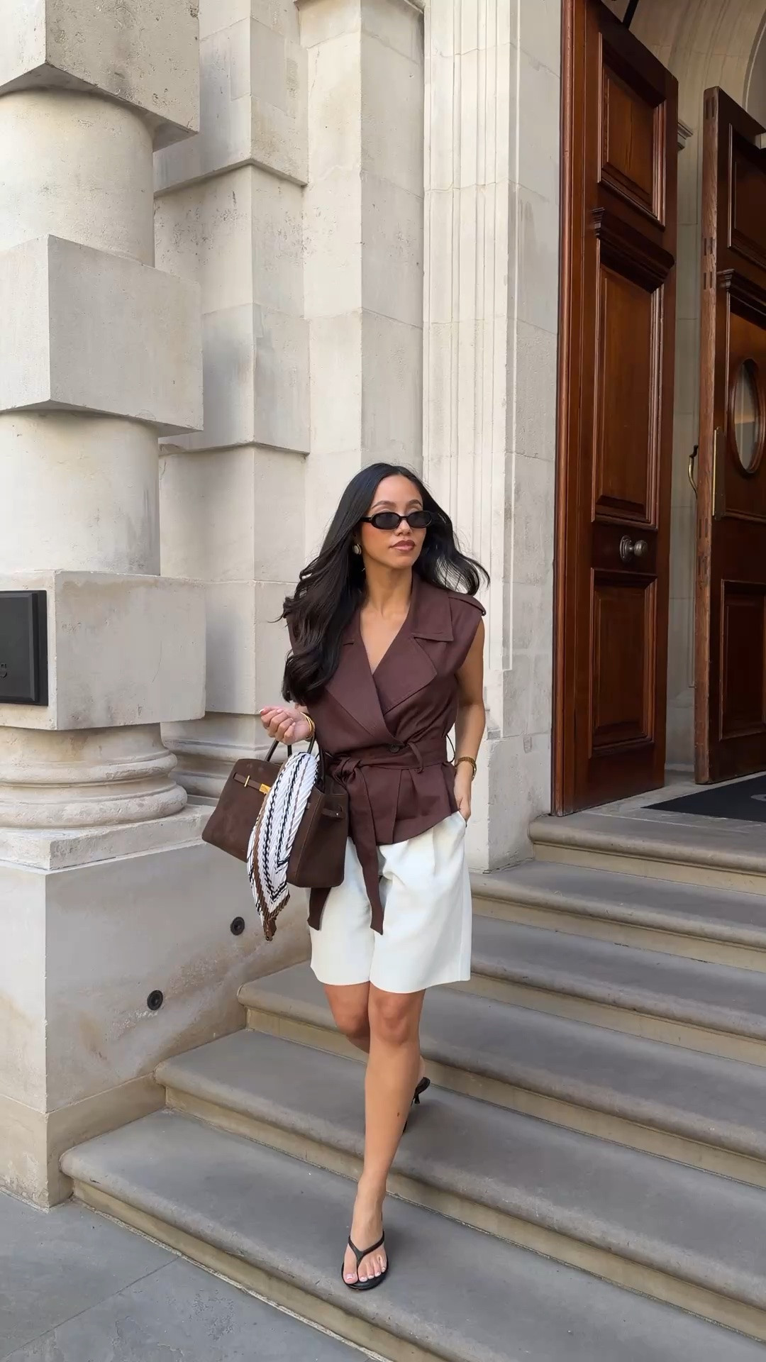 Spring / summer in the city OOTD. Chocolate brown cinched waist coat, Bermuda shorts from Because of Alice, flip flops and a suede bag with satin scarf detail

#LTKspring #LTKsummer #LTKstyletip