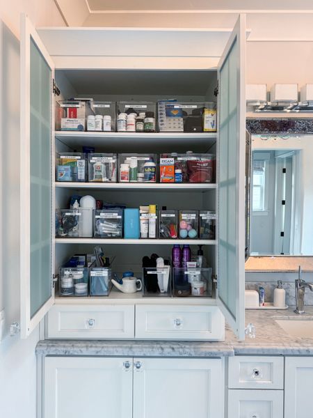 In this bathroom, I started by adding a third shelf which solved a couples issues: 1. No long stacking containment and 2. Items were getting stuck or lost in the back of the cabinet. Adding the shelf provided more surface space to add additional bins. This bathroom cabinet contains all of their medicine, medical tools, sun care, extra skincare, and more. The bins come in a few widths and depths and each one includes a divider! Love!!!

#LTKMostLoved #LTKfamily #LTKbeauty