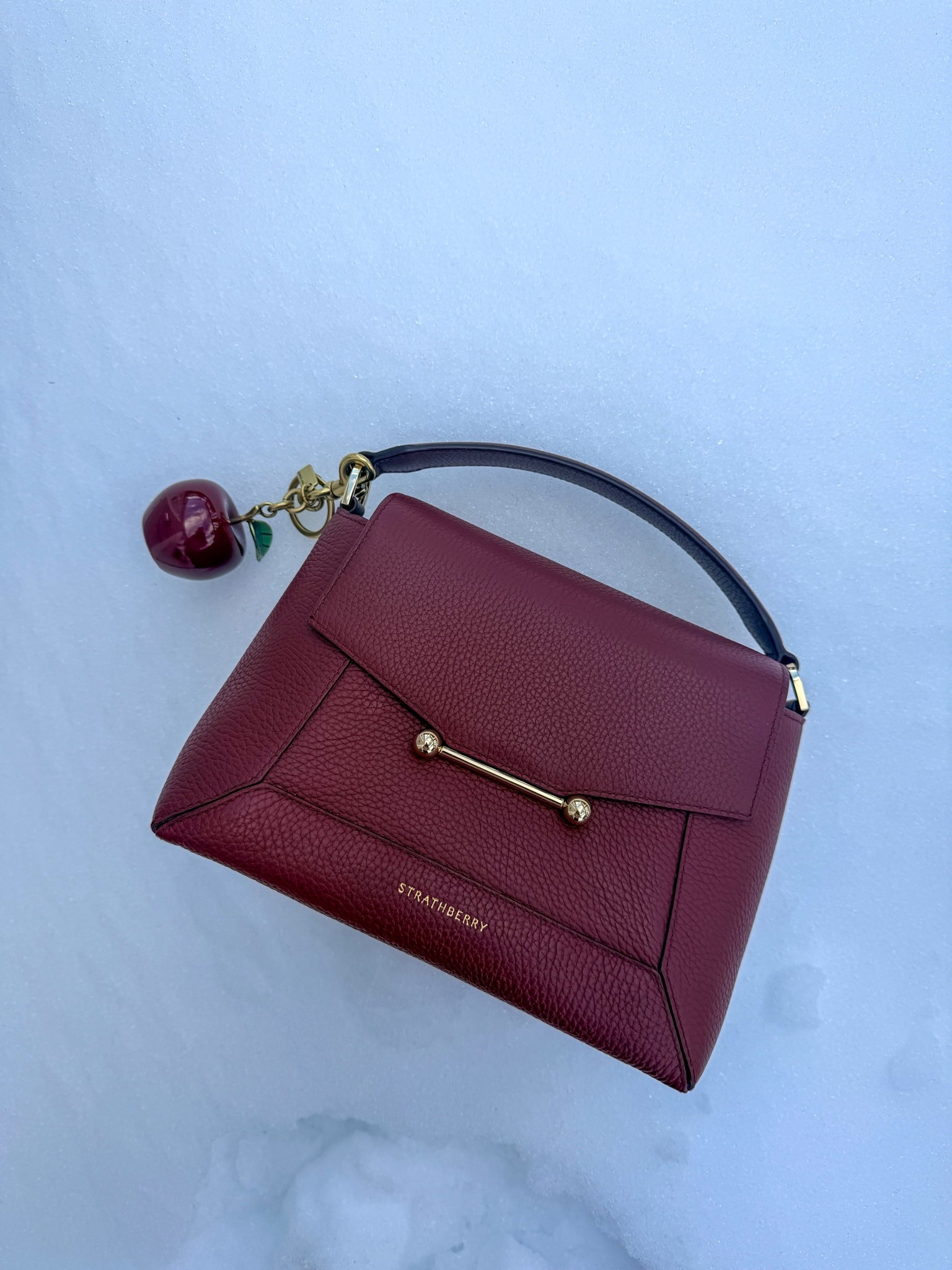 A little snow moment with my Strathberry Mosaic ❄️
This bag has quickly become one of my favorite pieces, the oxblood shade is especially beautiful this time of year and works surprisingly well for Valentine’s Day. It creates the prettiest contrast with pinks, blush tones, making it easy to style without feeling too on-the-nose.
Structured, polished, and did I mentioned hand made; it’s practical enough for everyday wear, this is one of those bags that elevates even the simplest winter outfit. A timeless piece that you can wear year round.

#LTKOver40 #LTKWorkwear #LTKValentine