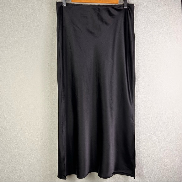 Topshop Black Satin midi skirt UK10 US6
Elastic Waistband side slits both sides | Poshmark