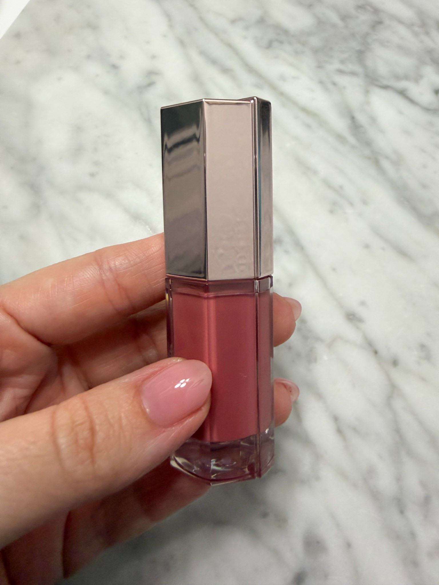 Another rosy pink I’m loving right now is the new shade I picked up in my favorite lip oil from Lancôme. I already have Rosy Plump, which is all I’ve been wearing gloss-wise lately, and I wanted to add another color to my collection. I picked up shade 33 Idôle Nude, and it’s the perfect rosy nude pink. This lip oil has become my go-to over the last few months. My lips feel hydrated, look shiny like a gloss, and best of all, it’s not sticky.

#LTKdayinmylife #LTKmorningroutine #LTKgrwm