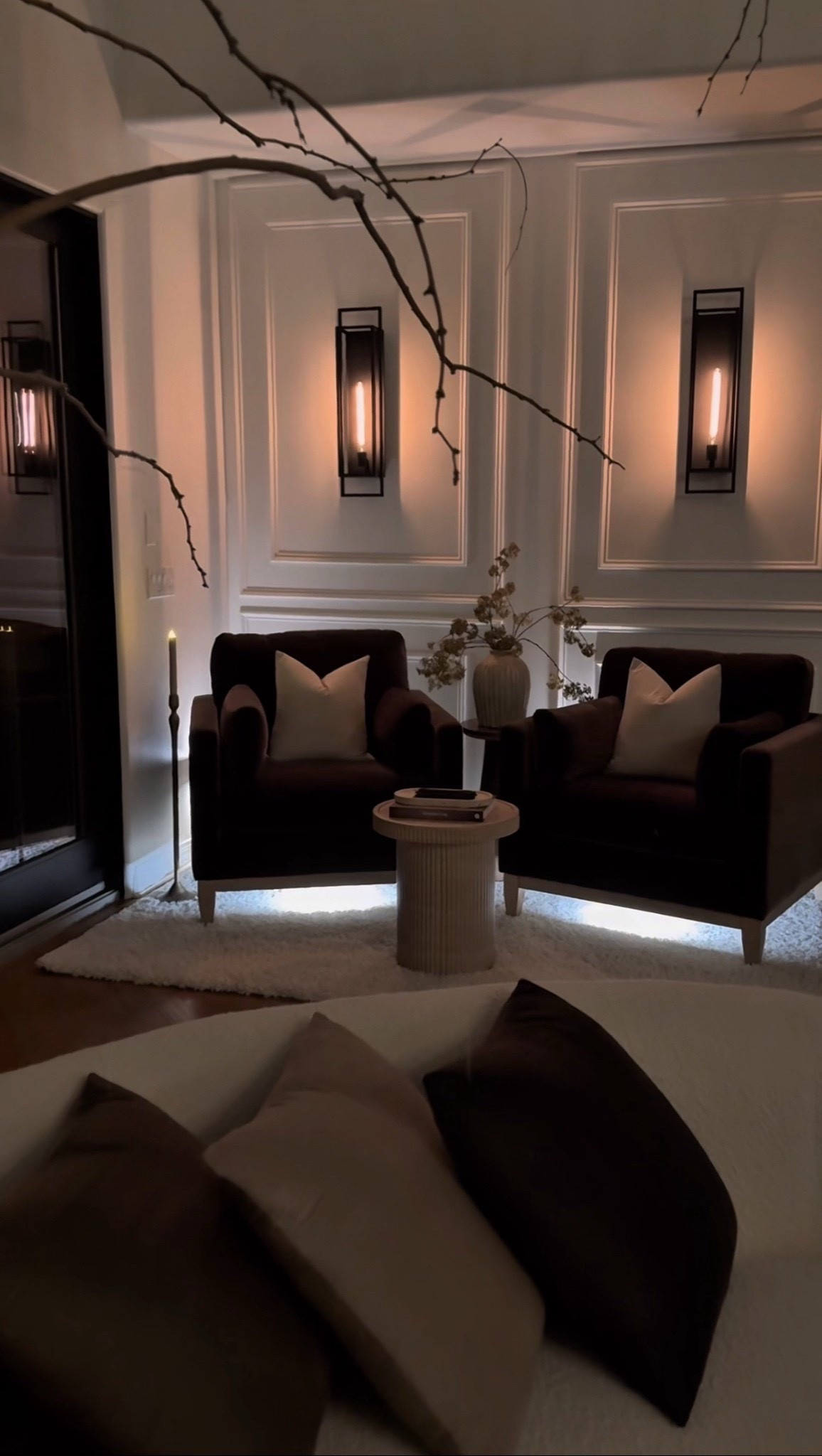 Soft lighting and warm neutrals set the tone for the coziest nights in. 🤎 From sculpted accent chairs to the ribbed side table and ambient wall sconces, every detail adds to the modern, moody charm of this space. A timeless, neutral living room moment that feels inviting and elevated.


#moodyhomedecor #neutrallivingroom #cozycornerinspo #modernhomestyle #accentchairgoals #wallsconcelighting #amazonhomefinds #warmminimalism #homestylingideas #timelessinteriors #summerthompsonstyles


#LTKHome