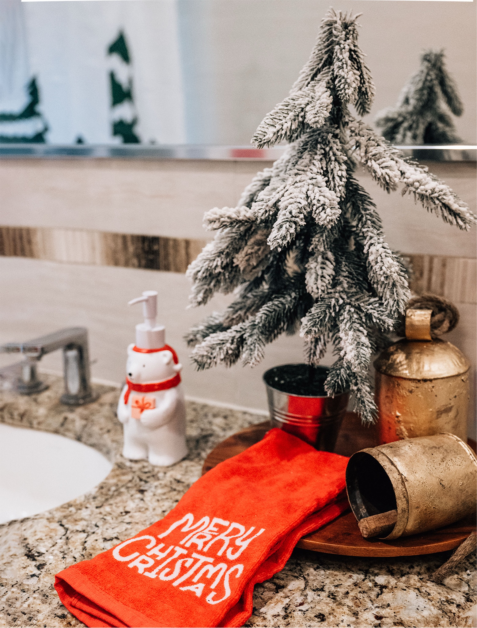 Festive and functional! 🎅✨ A frosted tree, gold bell, cheerful holiday towels, and an adorable polar bear soap dispenser bring Christmas cheer to the bathroom counter. Tap to shop these holiday accents and add a little magic to your space! #HolidayDecor #ChristmasBathroom #LTKSeasonal

#LTKHoliday #LTKHome #LTKParties