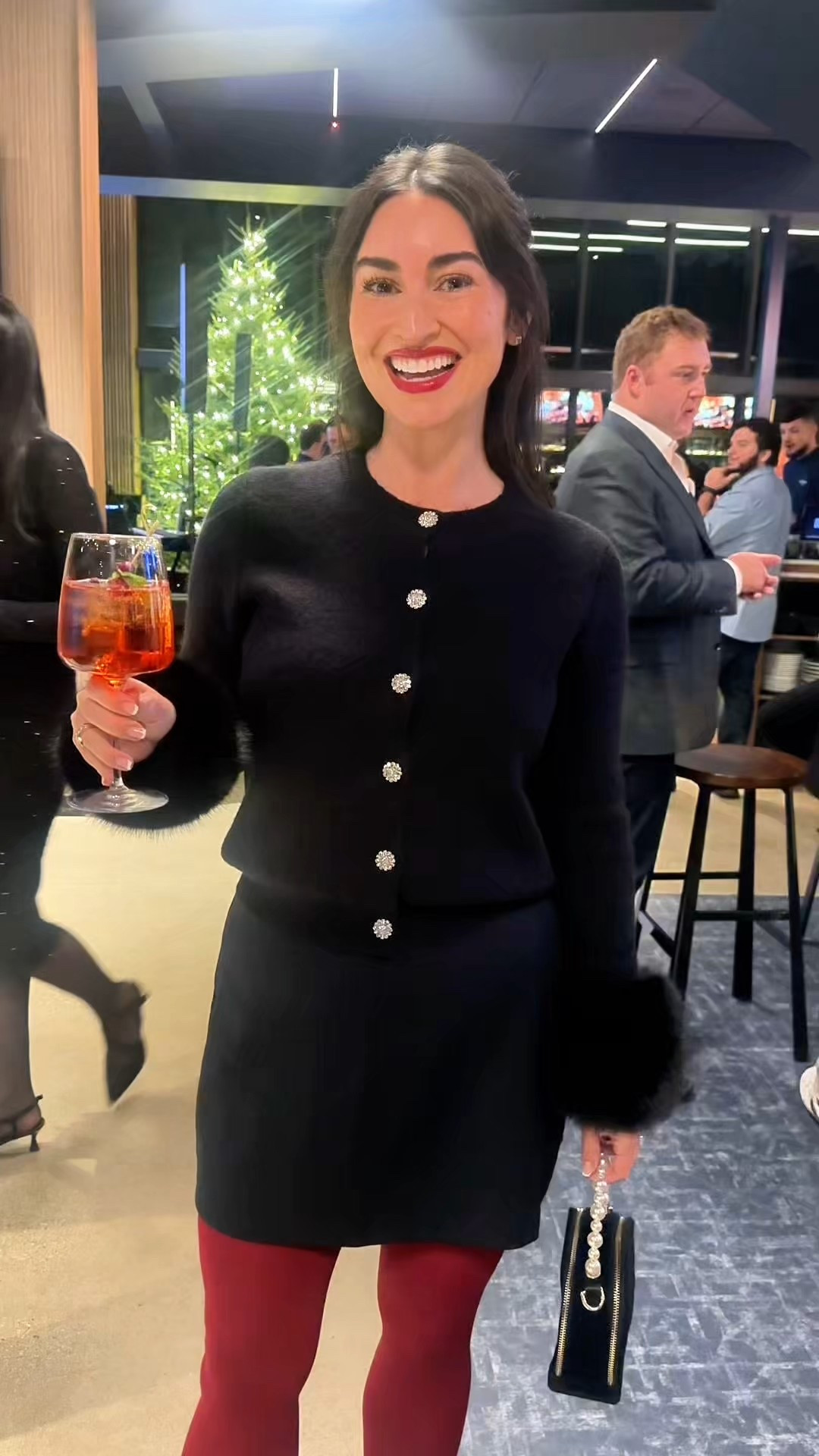 A shimmering holiday look in black, with a pop of the color of the year. 

#LTKHoliday