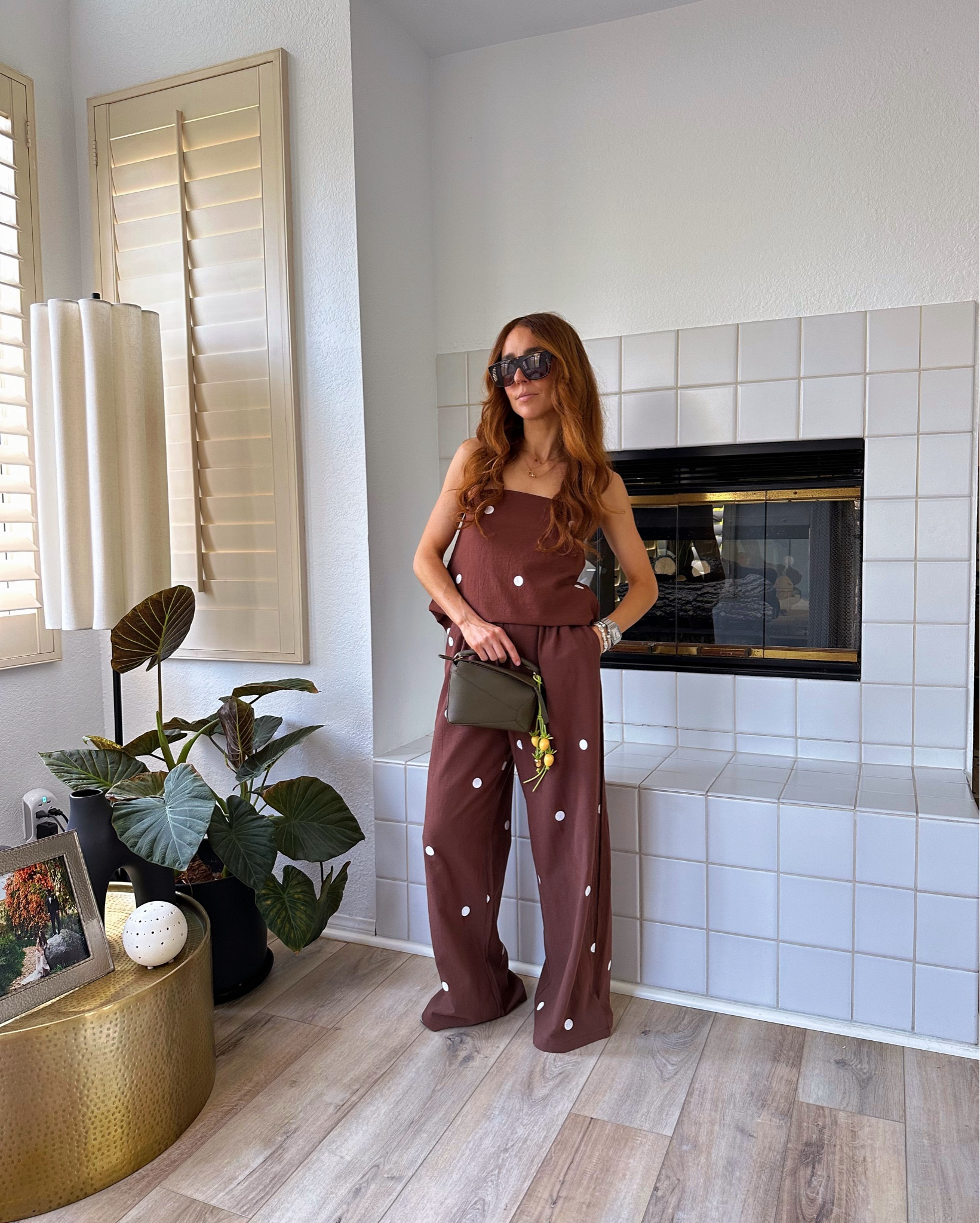 A polka dot suit for summer is a playful take on elevated casual style. Pair it with flip flops and an olive toned handbag for a subtle contrast. Style tip: add a playful bag charm that exudes summer vibes like a tomato charm. 

Wearing a size Small. I tucked in the top in front to elongate legs and let the back trail when I move. 

polka dot outfit | polka dots | summer outfits | summer fashion | casual elegance | sunset dinner outfit | travel style 


#LTKStyleTip #LTKSeasonal #LTKFindsUnder50