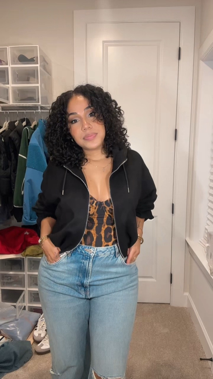 Not me posting an outfit I wasn’t even sure about… but y’all kept asking for the details so here we are 😂

This look is built around my FAVORITE structured swimsuit that doubles as a top from TA3 — it has a corset back, insane support, and is so flattering. I have it in multiple colors because it snatches you IN.

Paired it with:
• wide leg ripped jeans (Zara spring denim, high waisted wide leg jeans)
• black hoodie (my everyday Zara oversized hoodie, casual layering staple)
• combat boots (my Prada boots I randomly decided to pull out after 2 years 😂)
• mini clementine horse bag

This is one of those “jeans + going out top” outfits that works for dinner, drinks, or even a casual night out when you still want to feel put together.

Also yes… curls were a solid 6/10 but we move 😭

#ltkstyle #ltkunder100 #jeansoutfit #goingoutoutfit #widelegjeans #casualchic #ootd #springstyle #datenightoutfit #momstyle

#LTKvlog #LTKgrwm #LTKootd