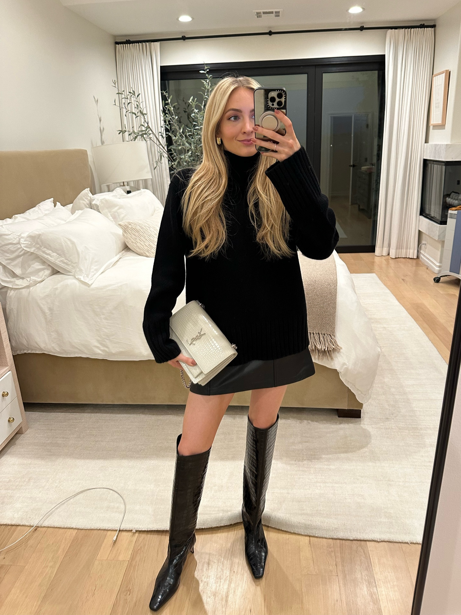 Girls dinner 🖤 black cashmere turtleneck over a black leather mini skirt and croc over the knee boots

Use code SE15 for 15% off the Jenni Kayne turtleneck 

Sizes worn here:
Turtleneck XS (oversized fit)
Skirt XS (TTS)
Boots 39.5

#LTKstyletip #LTKHoliday #LTKitbag
