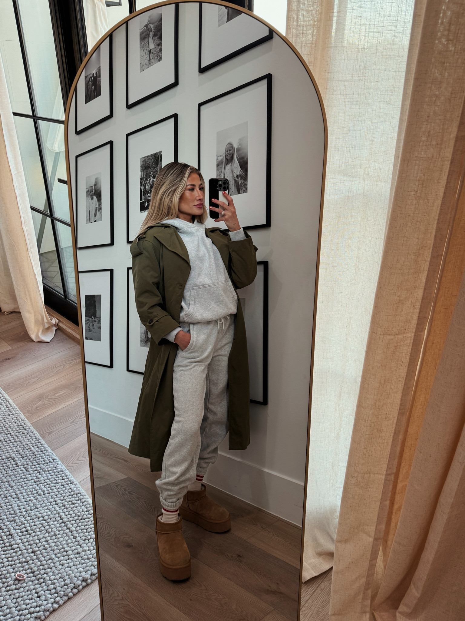 my go-to throw and go outfit. these sweatpants are FULLY restocked - run because this color is always sold out. TTS on the bottoms and for the hoodie I size up one size for women’s. I do have this hoodie in camouflage in the men’s sizing because that’s all they had left and I sized down to an XS. So I size up 1 in women’s hoodies and size down 1 to men’s hoodies. This trench is a winner! The color, the style. It’s soft but still structured without being stiff. Platform Ugg boots are 20% off rn! 

#LTKStyleTip #LTKSaleAlert #LTKFindsUnder50