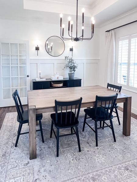 Dining room / dining set / dining table / black chairs / Ruggable / washable rugs / black chandelier / round mirror / black wall sconces / board and batten / lined curtains / white drapes / olive plant / everlasting candle 

#LTKunder100 #LTKunder50 #LTKhome