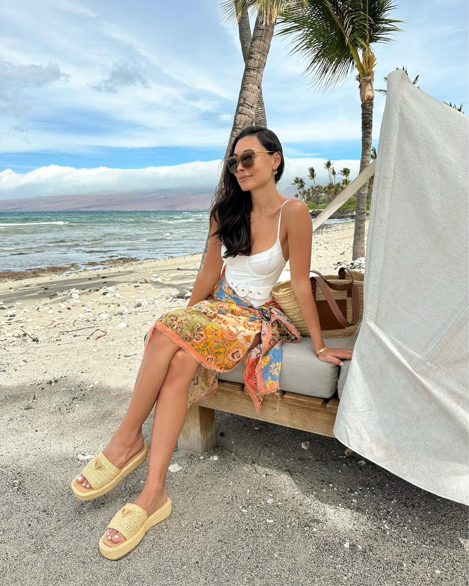 Kat Jamieson wears a bathing suit in Hawaii. Sarong, swimsuit, swimwear, resortwear, Prada raffia sandals, swim, vacation outfit, spring outfit. 

#LTKSeasonal #LTKswim #LTKtravel