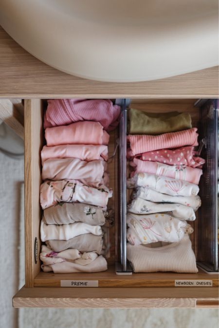 Nursery organization with clear drawer dividers to sort baby clothes by size from preemie to newborn onesies, newborn footies and more. Also linking our diaper changing pad, dresser and diaper pail. 

#LTKfamily #LTKbaby #LTKhome