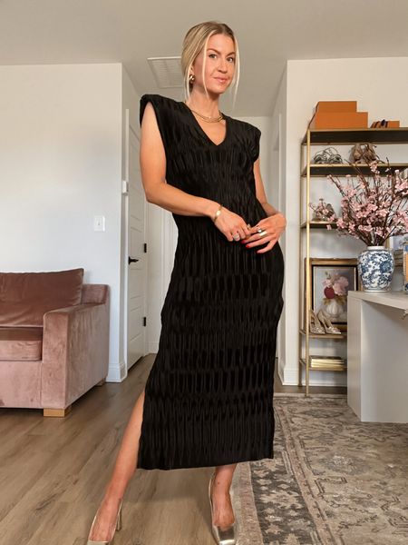 Black stretchy pleated dress with shoulder pads - runs TTS wearing XS 

#LTKstyletip #LTKwedding #LTKSeasonal