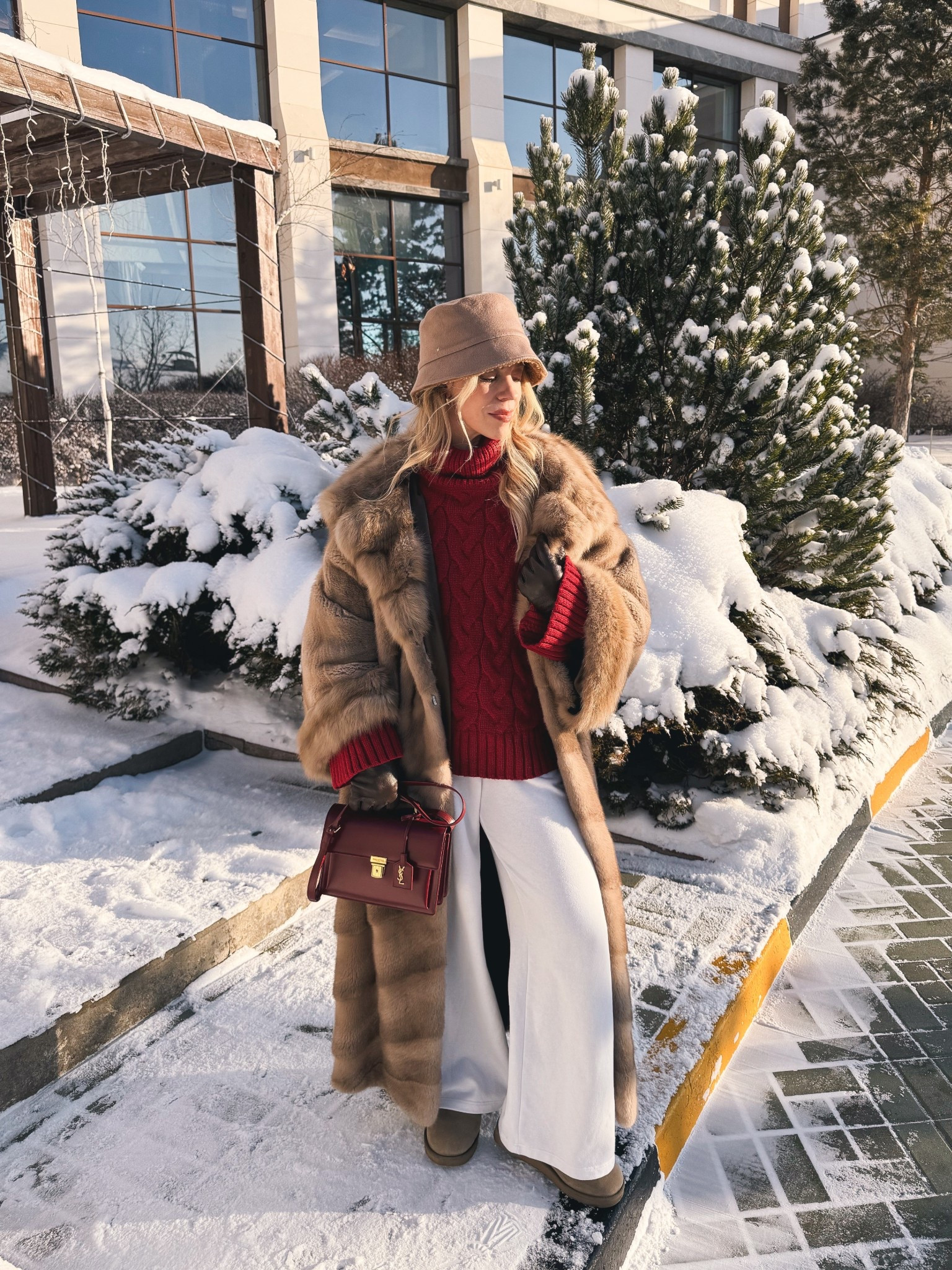 Cozy winter style with oversized fur coat, red cable knit sweater, white wide leg joggers, Ugg ultra mini boots, shearling bucket hat 

#LTKHoliday #LTKFindsUnder50 #LTKSeasonal