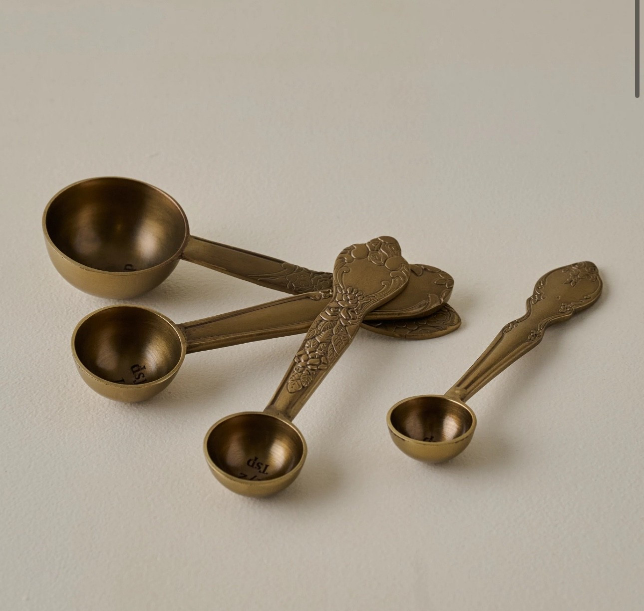 MY FAVORITE! 
Antique brass measuring spoons

Perfect addition to your kitchen!
Great idea for a gift for a baker, hosting gift or even neighbor gift! Pair it with an air of homemade vanilla or festive spices!