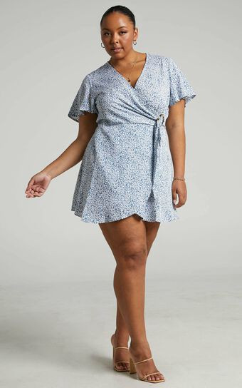 Prudence Flutter Sleeve Wrap Mini Dress in Blue Floral | Showpo (US, UK & Europe)