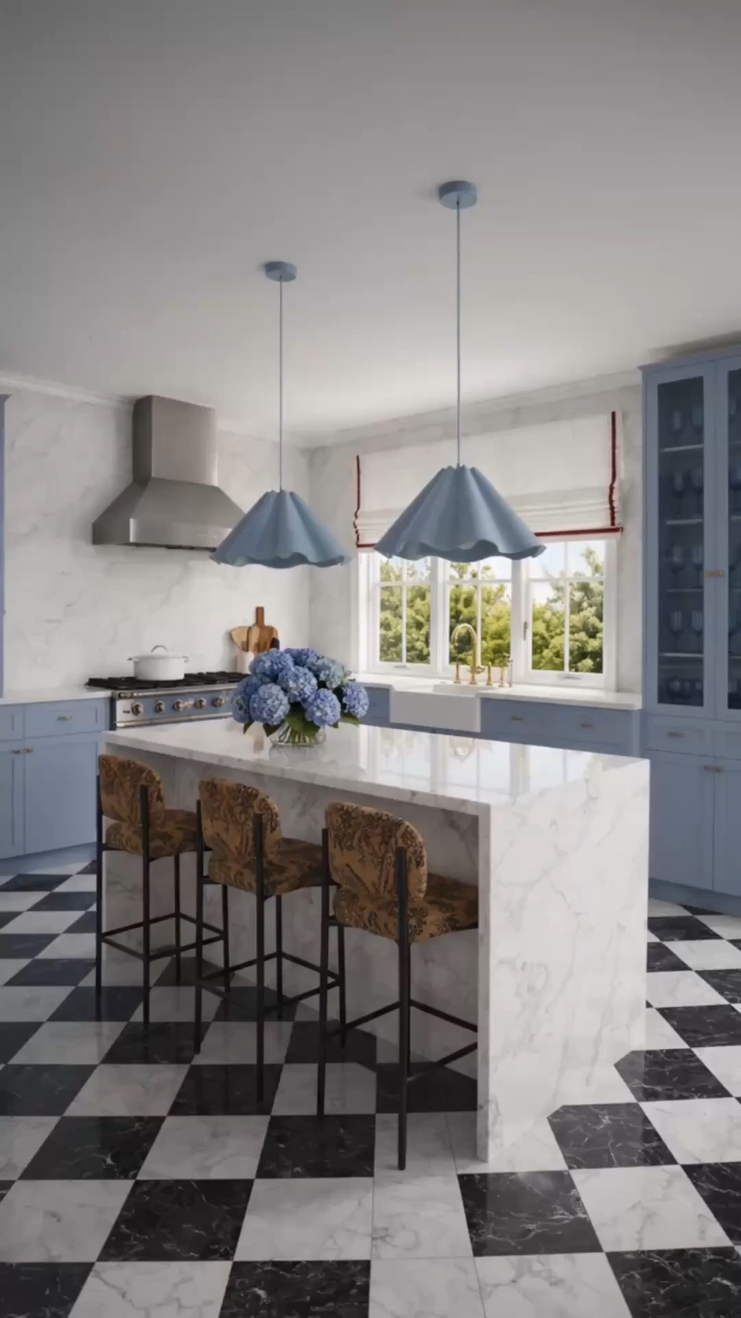Getting the kitchen ready for gathering season starts with creating a space that feels polished, welcoming, and easy to use when family and friends come over. ✨

I love the mix here of soft blue cabinetry, crisp marble, black-and-white checkerboard flooring, warm patterned counter stools, sculptural pendant lights, and the red-trimmed Roman shade. It feels fresh and refined, but still has enough color and personality to carry beautifully into fall and the holiday entertaining season.

This is the time to start thinking ahead—refresh the seating, lighting, glassware, cookware, and serving pieces now so the kitchen is ready for casual brunches, cocktails around the island, and all the gatherings ahead.

#GatheringSeason #HolidayEntertaining #KitchenRefresh #Kitchen #KitchenDesign #KitchenIsland #BarStools #CounterStools #PendantLighting #RomanShade #BlueKitchen #MarbleKitchen #CheckerboardFloor #WineGlasses #Cookware #KitchenFaucet #FlowerArrangement #KitchenDecor #EntertainingAtHome #ModernClassic #LTKHome #LTKdayinmylife #LTKSaleAlert

#LTKdayinmylife #LTKHome #LTKSaleAlert
