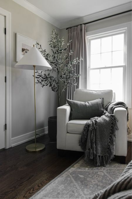 This cozy corner moment in our primary is everything! This chair has been a favorite of mine for years, and we just recently added this other pottery barn favorites—throw, tall tree, and floor lamp! 

#LTKhome #LTKstyletip