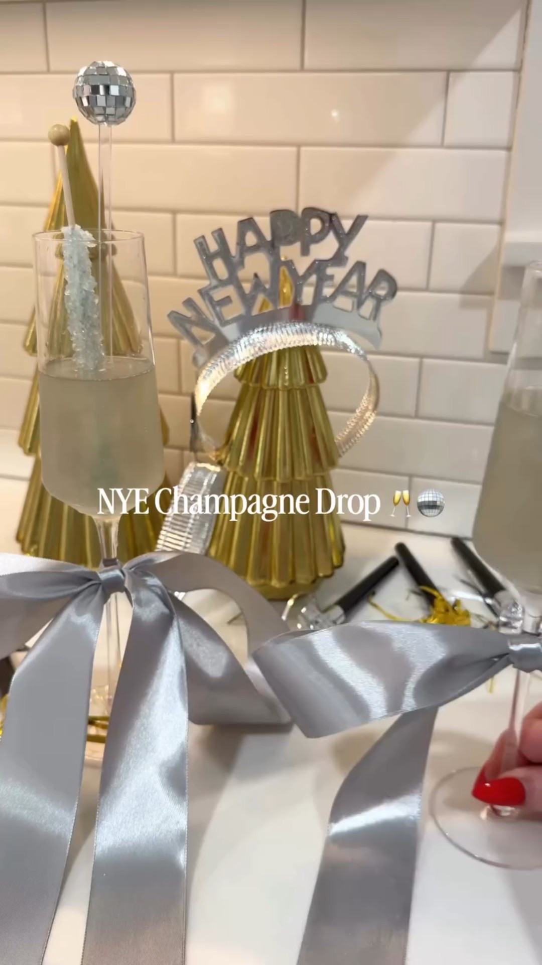 NYE Champagne Drop 🥂🪩✨

Save this festive drink idea for your New Year’s Eve party at home! 

First tie silver ribbon around the stem of each glass and then pour champagne into your glasses (you can also use sparkling grape juice!)!

Then, roll mini ice balls into edible glitter - I used @cakecraftusa Dazzle Dust edible glitter in silver which can be used on any baked good as well! I found mine on the holiday display found in the party supplies aisle 🙌🏻 Just before the clock strikes midnight, drop the glitter ice balls into your champagne flutes and then add some rock candy and festive cocktail stirrers! It’s a fun way to celebrate the new year with family and friends! #Cakecraft #WalmartFinds #EdibleGlitter #Sponsored 

Comment GLITTER for details! 

.
.
.
.
.
#nye #nyedrink #nyeballdrop #nyedrinks #newyears #newyearsdrink #newyearsparty #partyidea #cocktailideas #newyearspartyideas #champagnedrop