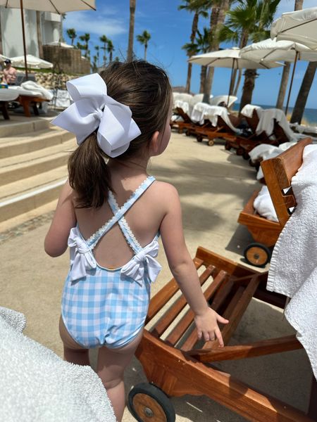 Charlotte is absolutely adorable in her Buckhead Blue Gingham swimsuit from The Beaufort Bonnet Company!  Check out more cute swimwear options for your little princesses. #BeaufortBonnetCompany #Swimwear #KidsSwim #LittleFashionistas

#LTKswim #LTKkids