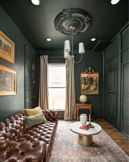 Darker paint on the walls and ceiling give the library a classically moody vibe.

#LTKhome