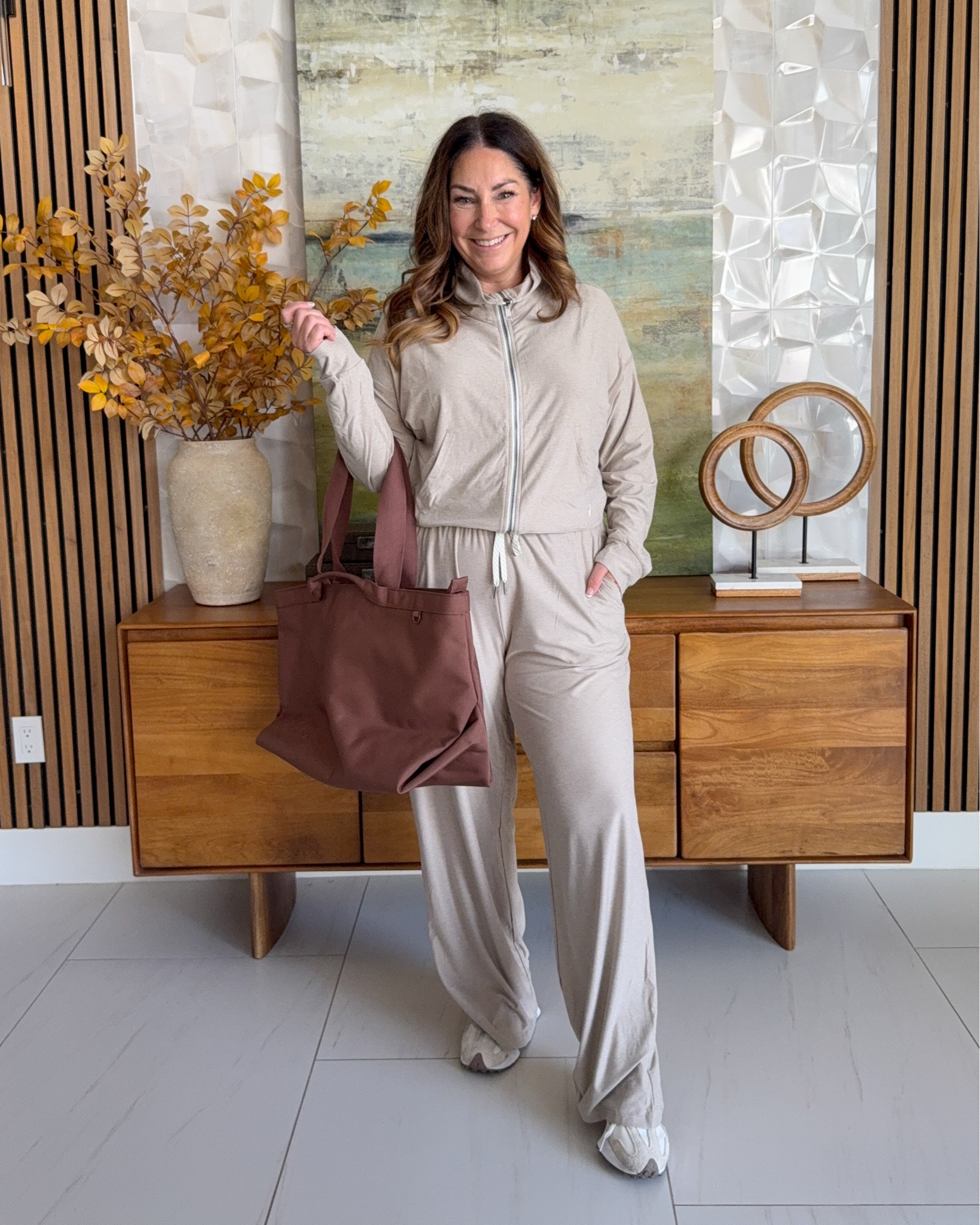 Comfiest travel set 🤎 @amazon Ododos Oatmeal beige zip-up jacket and matching wide-leg lounge pants, styled with a brown tote and sneakers. A cozy athleisure matching set for travel days, errands, and lazy weekends.

Sizing: Jacket and pants size up if in-between, XL

#LTKmomlife #LTKMidsize #LTKTravel