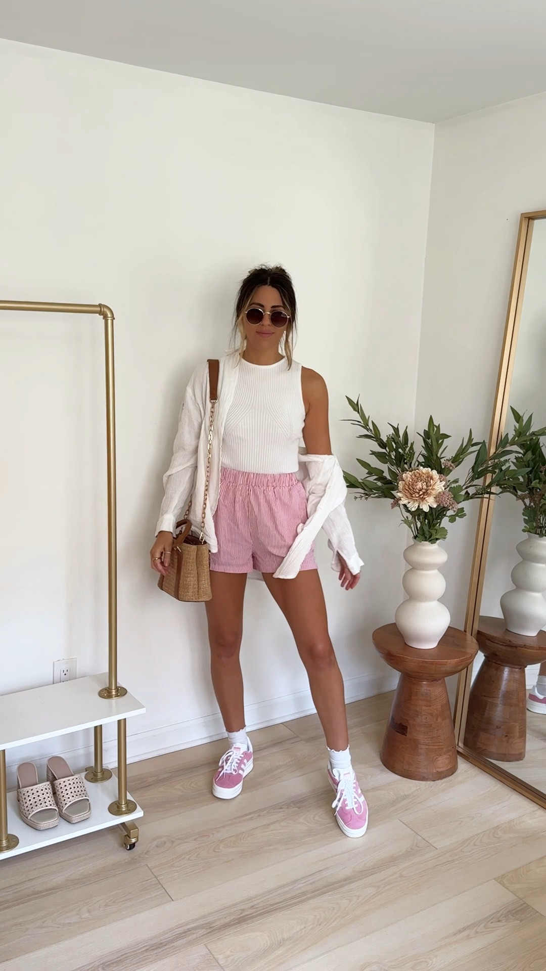 Styling boxer shorts (sized up to a  medium) for spring, paired with a white tank (small) and white button up (medium) and pink adidas sneakers 



#LTKstyletip #LTKfindsunder100 

#LTKVideo