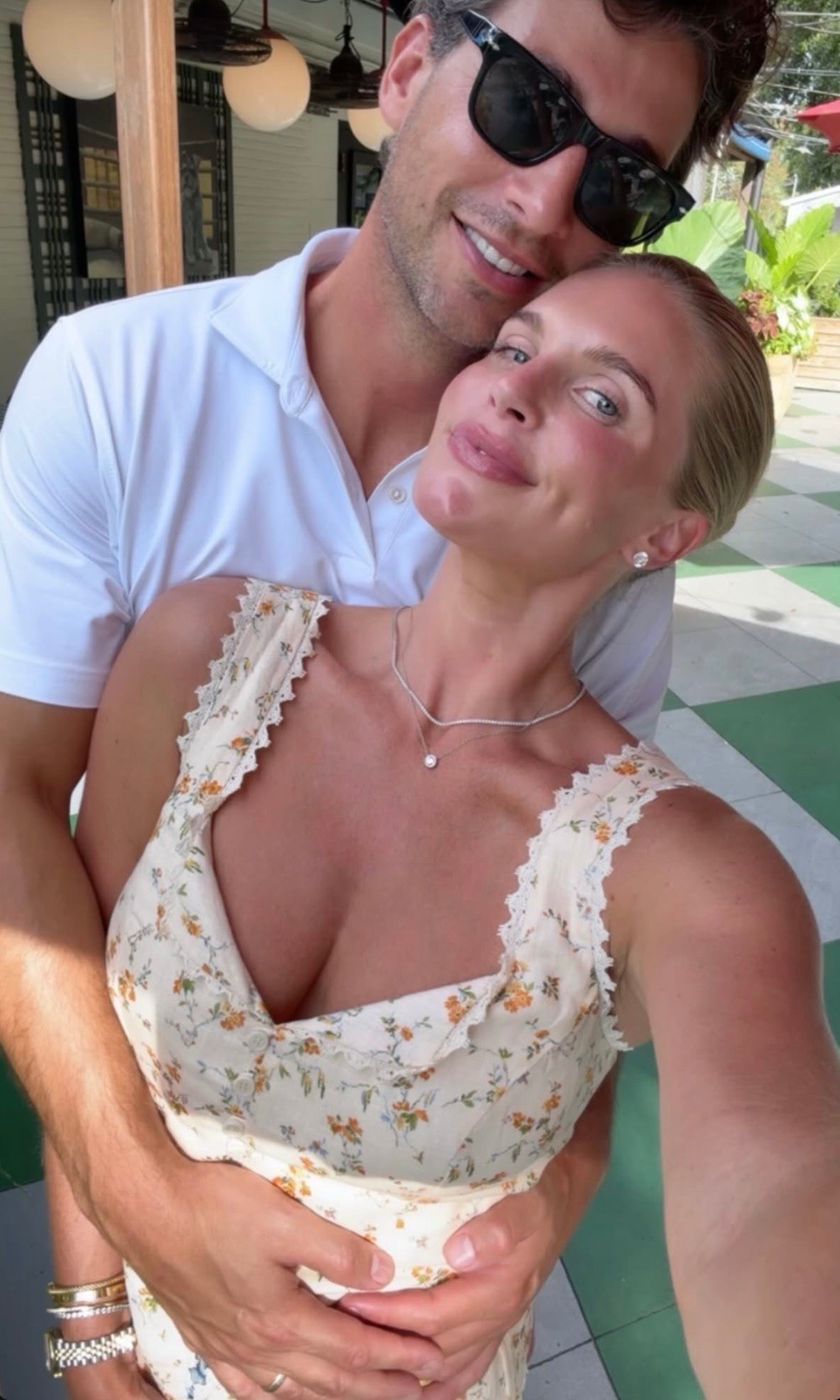 Madison LeCroy wearing a floral button front top