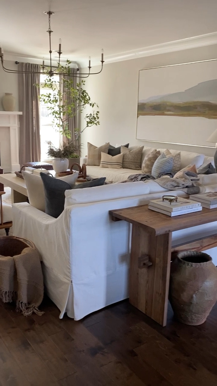 Neutral family room, amber interiors, McGee and co, studio McGee, studio McGee family room, white slip cover sofa, large art above sofa, curated pillows, pillow combinations

#LTKsalealert #LTKstyletip #LTKhome