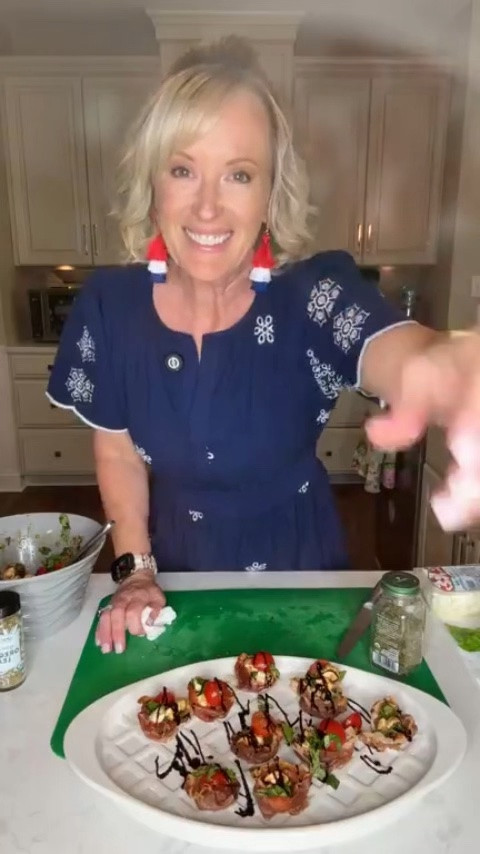 My new favorite summer appetizer is here! 😋 These Prosciutto Caprese Cups take everything I love about a classic Caprese salad and turn it into the most delicious bite-sized snack. They’d be the perfect addition to your Fourth of July spread, they’re easy to customize with your favorite toppings, and they’re so good you'll be making them all season long! Check out the recipe below and shop my patriotic look for the Fourth! ☀️🇺🇸

Prosciutto Caprese Cups

Ingredients:
-8oz of prosciutto 
-sugar bomb cherry tomatoes 
-mozzarella pearls
-fresh basil, sliced into ribbons
-a dash of dried parsley
-a dash of dried oregano
-balsamic glaze, both drizzled in the Caprese salad and on top of the Prosciutto Cups

Directions:
-Start by assembling your Caprese salad. Slice your cherry tomatoes in half, add in your mozzarella pearls, and slice your basil into ribbons. Then add in a dash of dried oregano and a dash of dried oregano. Drizzle balsamic glaze on top and toss salad together. 
-Set oven to 400 degrees for the prosciutto cups. 
-Place pieces of prosciutto in a muffin pan and fold the edges into the center to create cups. Bake for 10-11 minutes or until prosciutto looks crispy. Take out of the oven and let cool for 10 minutes so the prosciutto can harden. 
-Once they’ve cooled off, add your prosciutto cups to a plate and add your Caprese salad into it. 
-Top with balsamic glaze and enjoy!

#LTKSeasonal #LTKfoodie #LTKHome