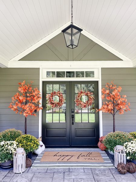 Fall porch is warm and inviting with light up maple trees, mums and some wreaths and a rug to match!

#LTKstyletip #LTKSeasonal #LTKhome