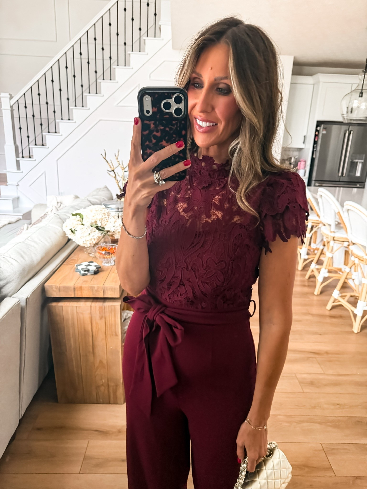 This burgundy jumpsuit is SO good for fall events! 🍷🤎 Love the lace details, flattering tie waist, and wide leg pants. Perfect for a fall wedding, date night, or holiday party!

burgundy jumpsuit, lace jumpsuit, fall wedding guest outfit, holiday party outfit, dressy jumpsuit, wide leg jumpsuit, date night outfit, fall event fashion, women over 40 style, themominstyle