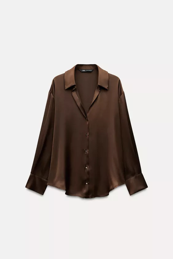 Flowing long sleeve shirt featuring a lapel collar, V-neckline and front fastening with golden bu... | Zara US