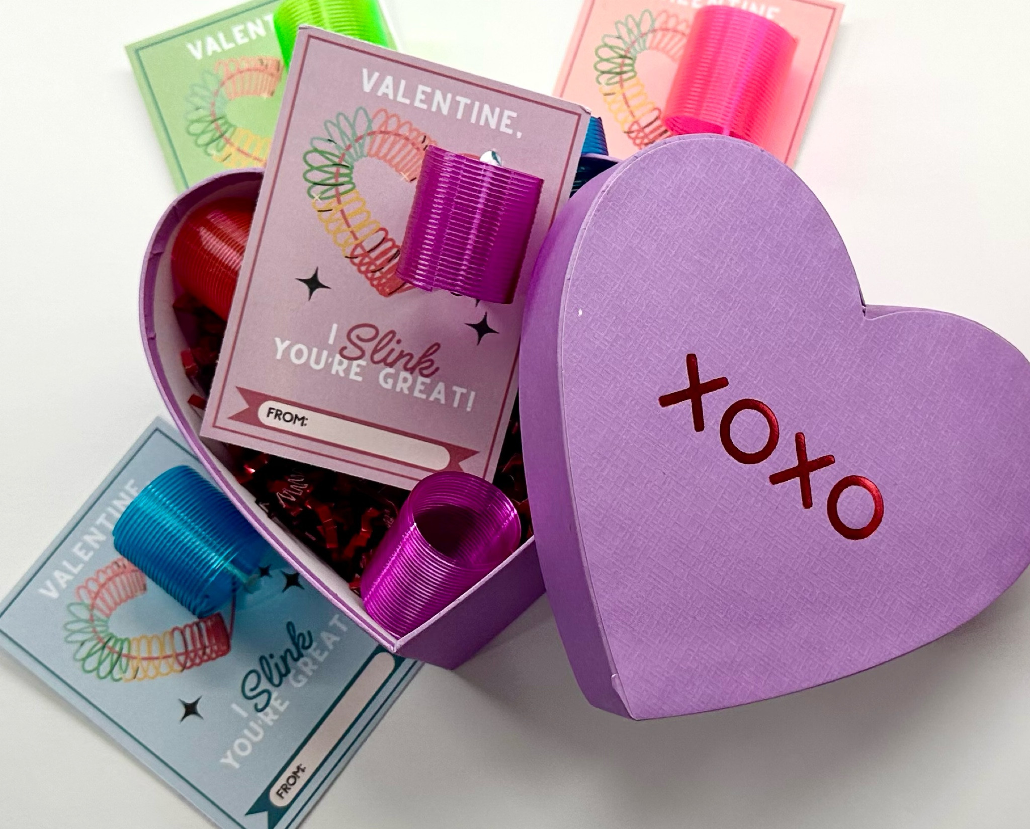 Day 5: I SLINK you’re great🌀🌈
🏷️Printable tags from the Letter Vee 
Slinky’s & heart gift box linked 🎀💜

Valentine tag links. Valentine gift links. Valentine gifts for her links. Slinky links. Gift box links. 

#LTKMostLoved #LTKGiftGuide #LTKSeasonal