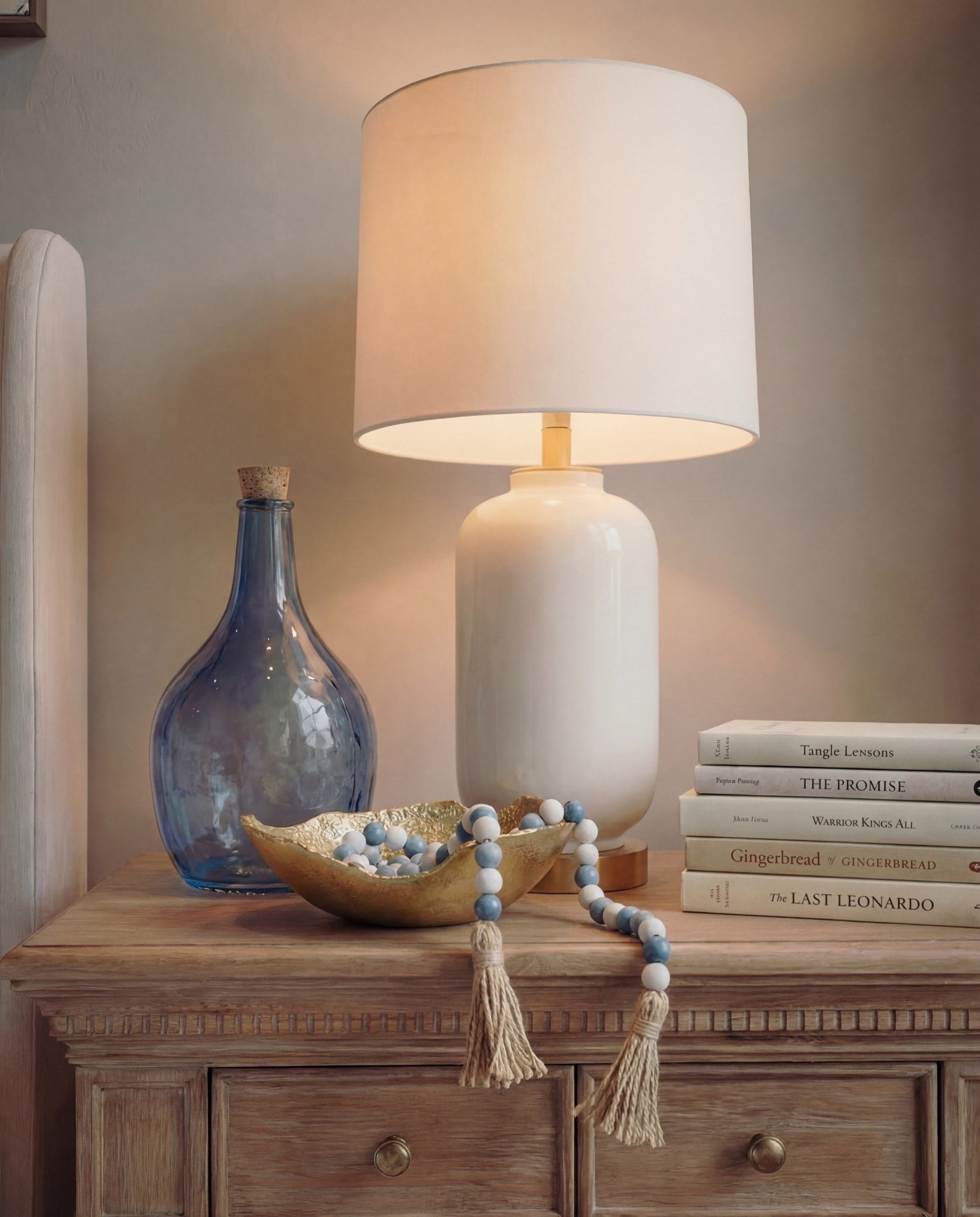 Shop the Look: Bedroom Refresh
• Upholstered bed frame (soft ivory fabric)
• Neutral bedding set (white and light beige)
• Brown throw blanket (plush or wool)
• Blue and ivory accent pillow
• Wood nightstands with drawers (warm oak tone)
• Ceramic table lamps (white base, white shade)
• Blue glass decorative vases
• Framed blue-and-white botanical wall art (set of three)
• Upholstered bench with fluted wood base
• Traditional patterned area rug (beige, taupe, muted blue)
• Floor-length neutral curtains
• Wood ceiling beams (natural stained finish)
• Brass decor bowl all catch
• White and blue decor beads 

#LTKSaleAlert #LTKHome