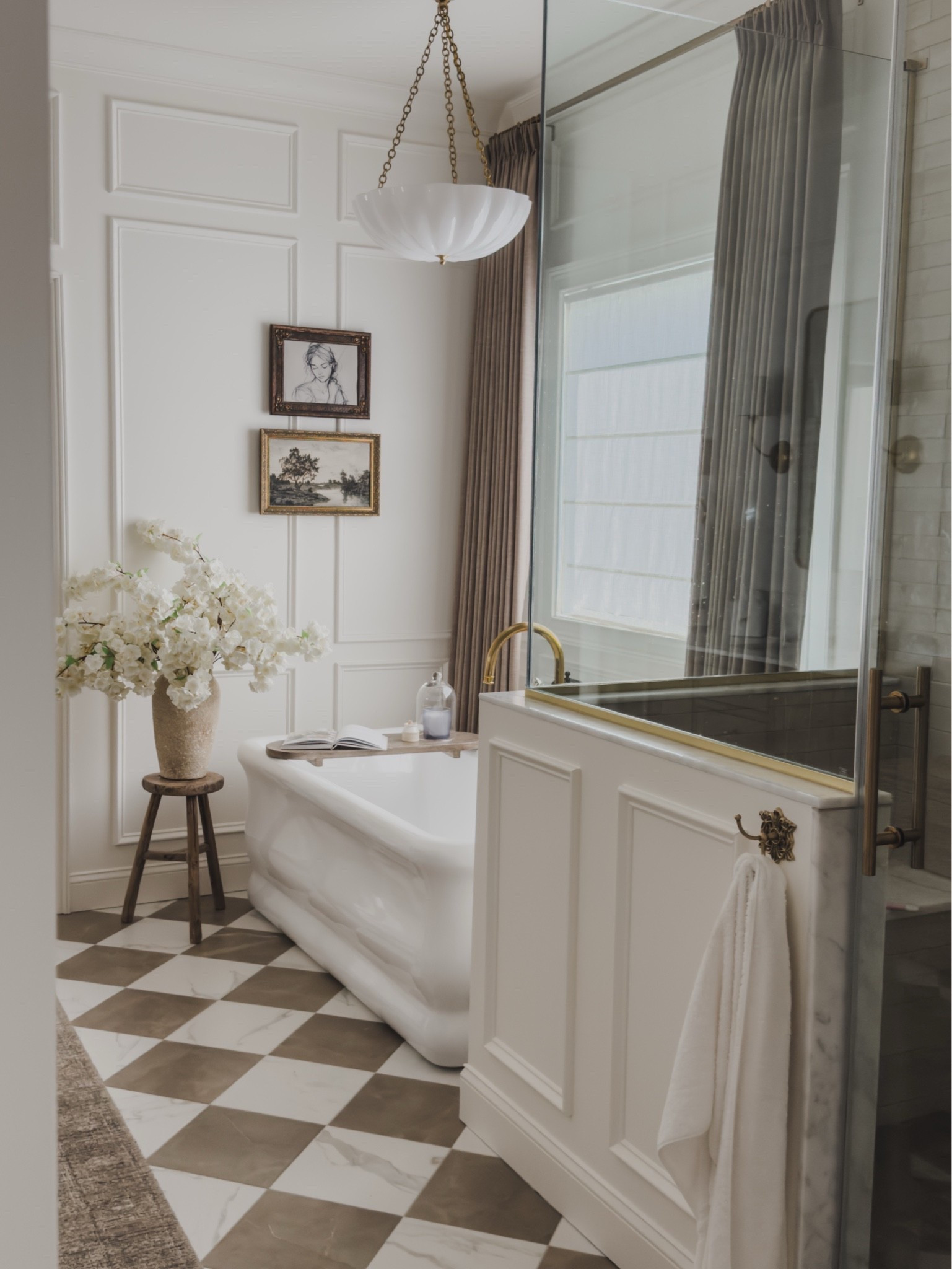 Timeless, collected primary bathroom! Layered details with classic tile and neutral tones with a touch of chic vibes. 

Home finds, neutral home inspo, collected style, primary bathroom details, statement lighting, unlacquered brass details, creamy whites, pinch pleat curtain, roman shades, accent stool, faux florals, gallery wall, tub caddy, vintage style rug runner, Wayfair, Perigold, Anthropologie, Afloral, McGee and Co, shop the look!

#LTKSeasonal #LTKHome