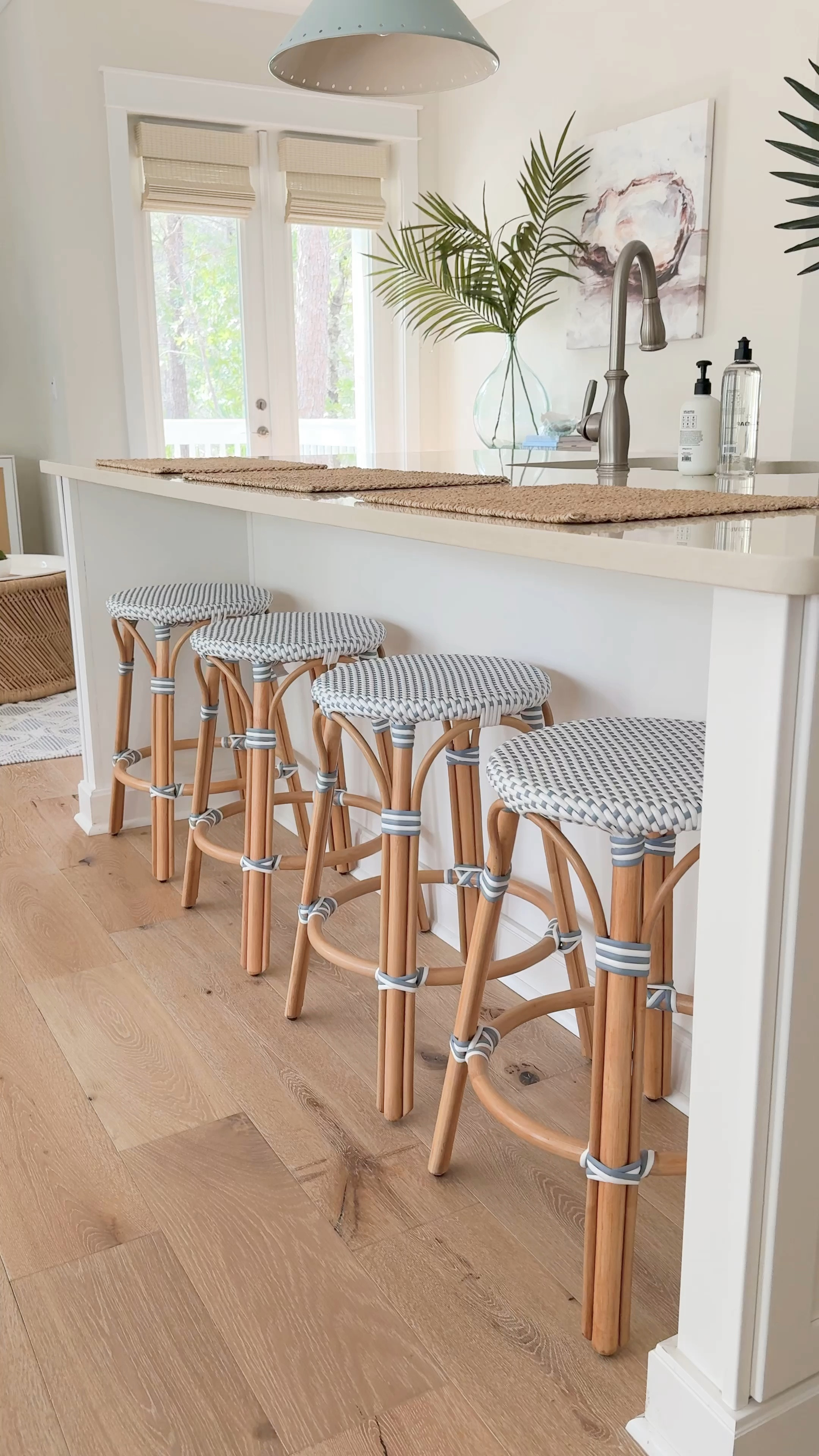 COASTAL KITCHEN - Kitchen and living room details at Hola Beaches Casita! We love these designer look-for-less counter stools with the bamboo legs and woven blue and white seat! They look so cute paired with these light blue pendant lights and faux palm stems. Also linking our oyster art, blue and white rug, bamboo coffee table, rattan TV cabinets and more!
.
#ltkhome #ltkseasonal #ltksalealert #ltkfindsunder50 #ltkfindsunder100 #ltkstyletip

#LTKSeasonal #LTKHome #LTKSaleAlert