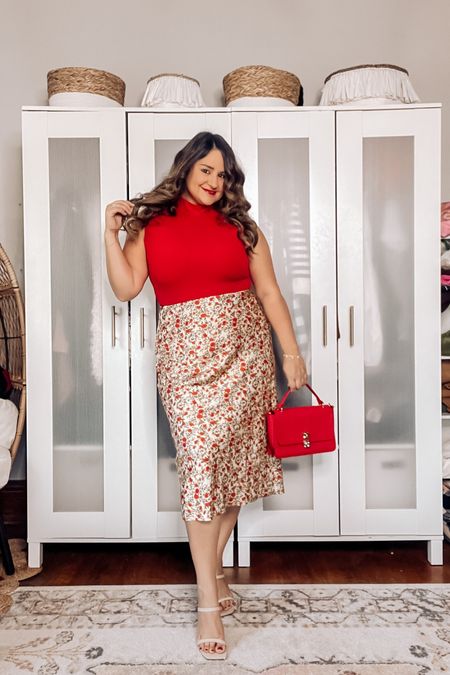 A statement work outfit to help you slay in the boardroom ♥️ 

Red is my power color to wear in my office outfits! I’ve styled this buttery soft Pumiey bodysuit with a dainty floral satin midi skirt, nude heels, and a statement handbag to complete this early fall outfit!

Wearing an xl in both 

Office look, workwear, business casual, satin midi skirt, floral skirt, satin skirt, amazon outfit, Amazon workwear, red top, midsize style, curvy style 

#LTKworkwear #LTKmidsize