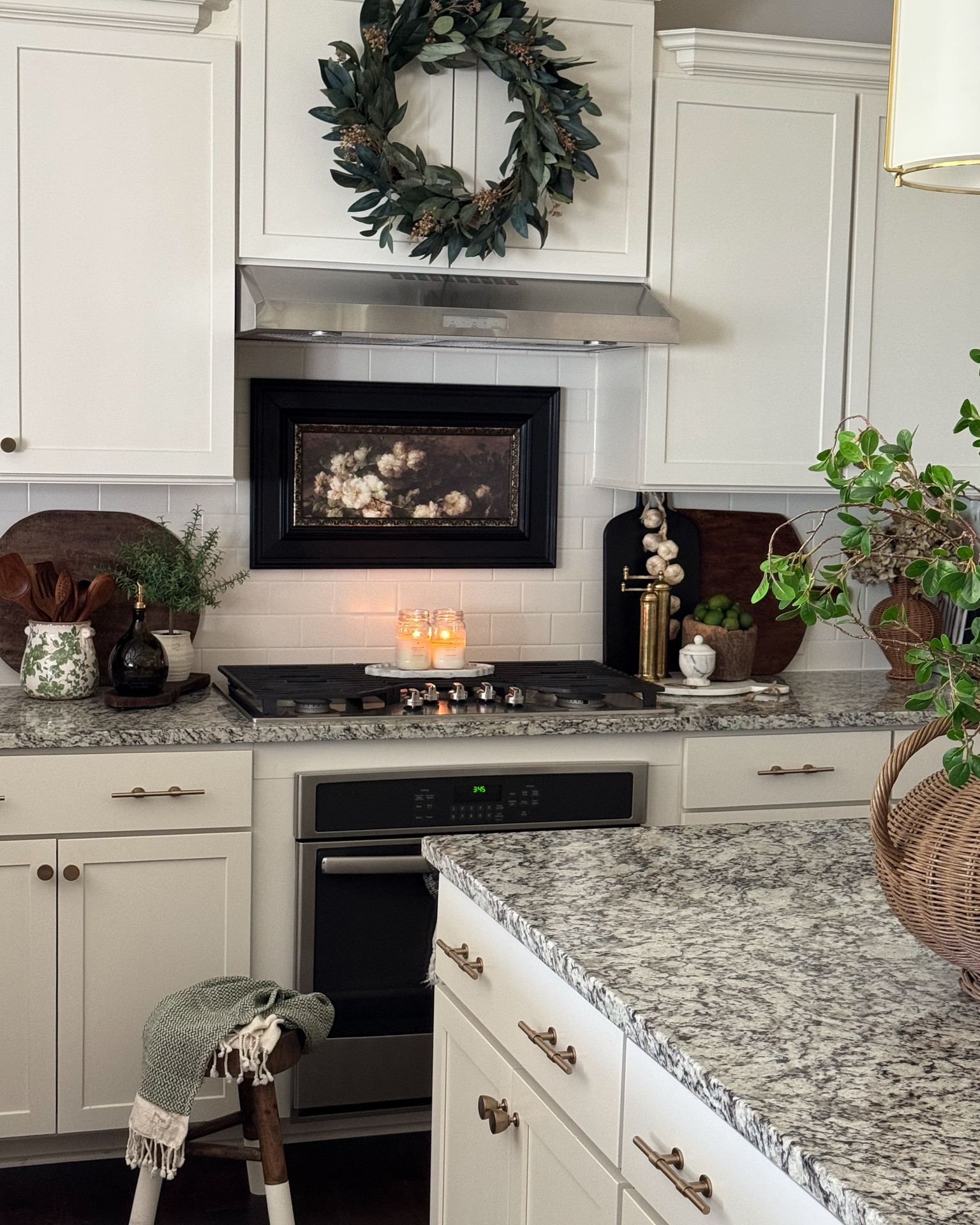 Summer kitchen with touches of green💚 Very impressed with the beautiful green floral crock. Mine is 6".

Utensil holder, floral crock, wood utensils, vintage cutting boards, olive oil dispenser, gold spouts, round marble board, garlic garland, green limes, marble salt holder, vintage wood bowl, Turkish green towels, brass salt & pepper mills, green wreath, moody green hydrangeas, dipped leg stool, woven vase, black serving board

#LTKSeasonal #LTKstorytime #LTKHome