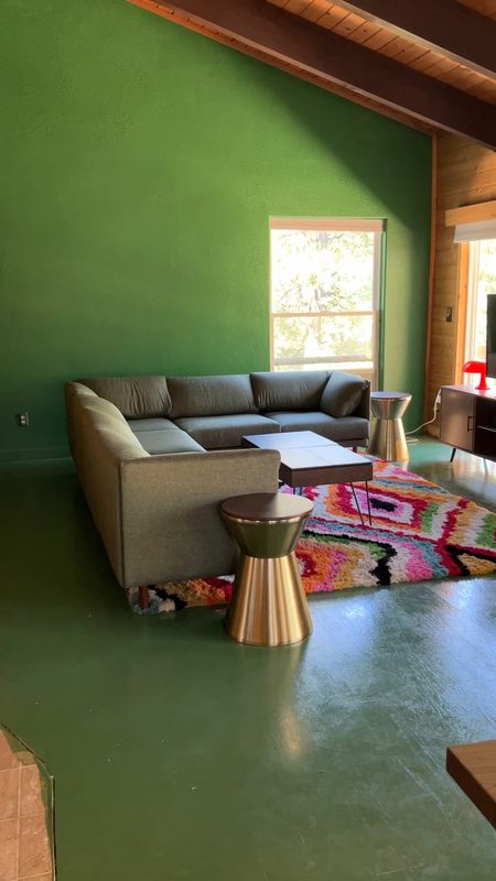 Green living room is really coming together 👏 love my new burrow couch and colorful rug! 

#LTKhome #LTKxAnthro #LTKFind