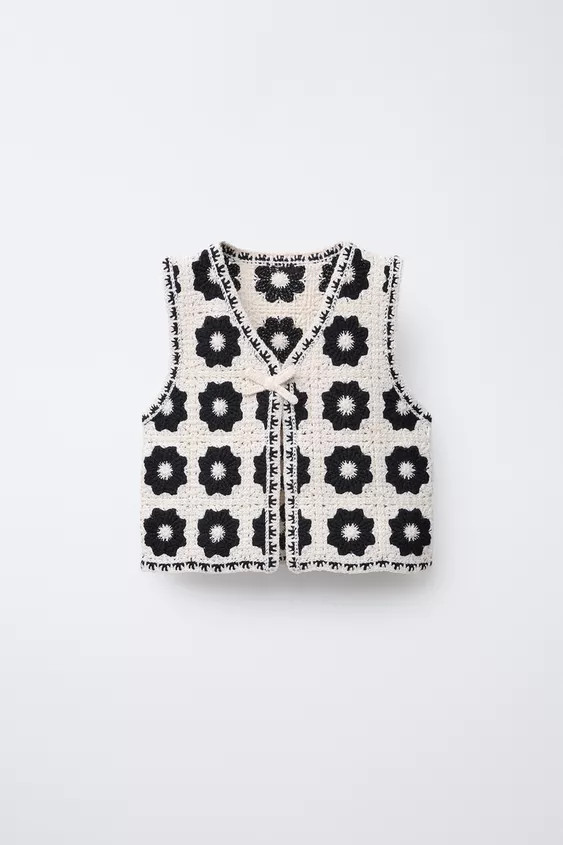 Knit vest with V-neck and sleeveless. Front button closure hidden by tie. | Zara US