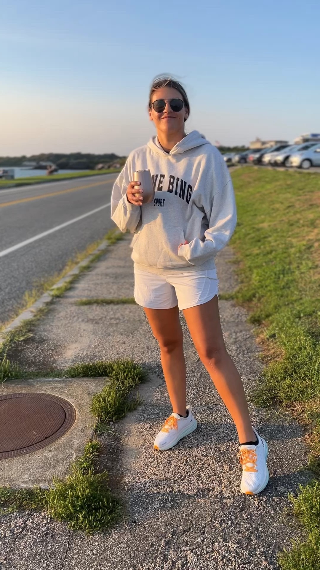 Comfy sunset outfit. 

Anine bing, sweatshirt, Lululemon, running shorts, hoka, sneakers, sunset 