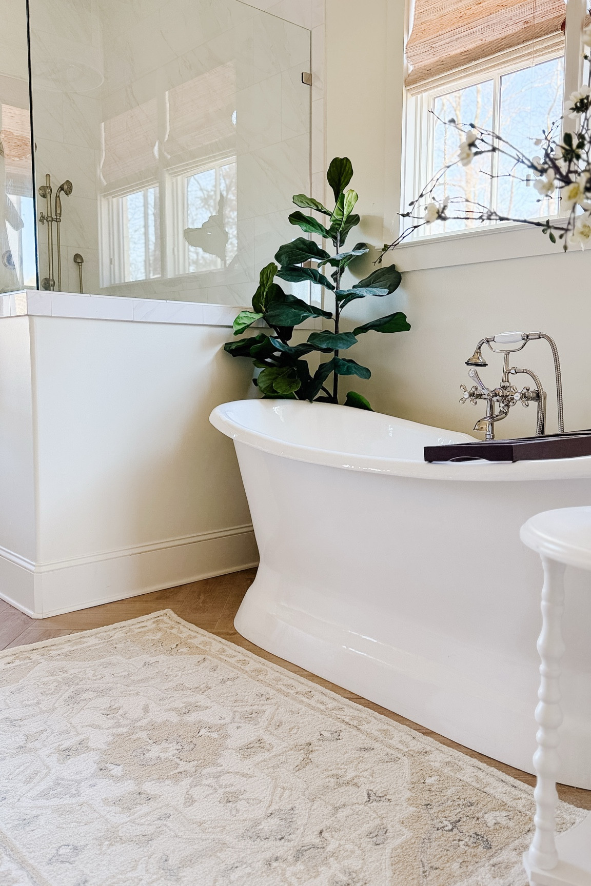 Primary bathroom views. 🤍 a new add to our bathroom has been this wool rug in a beautiful beige with soft blue grays and creams. Also to note is this faux fiddle leaf fig. I have two of these in our home and have for years. They are a great price point for the size! 

#LTKHome