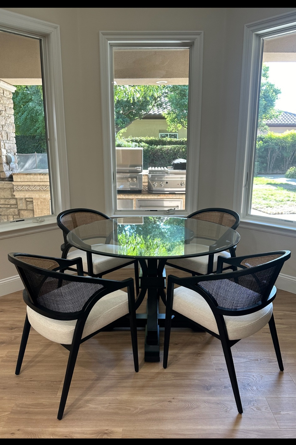 Gorgeous black/tan rattan breakfast nook set 🖤🤎.  These are the most gorgeous dining room chairs. I 🖤 them!!! Accompany with a black wood table base and 48” glass top. 
#lauraporterdesigns #arhaus #breakfastnook #diningtable #blackchairs #rattanchairs #glasstabletops 


#LTKHome