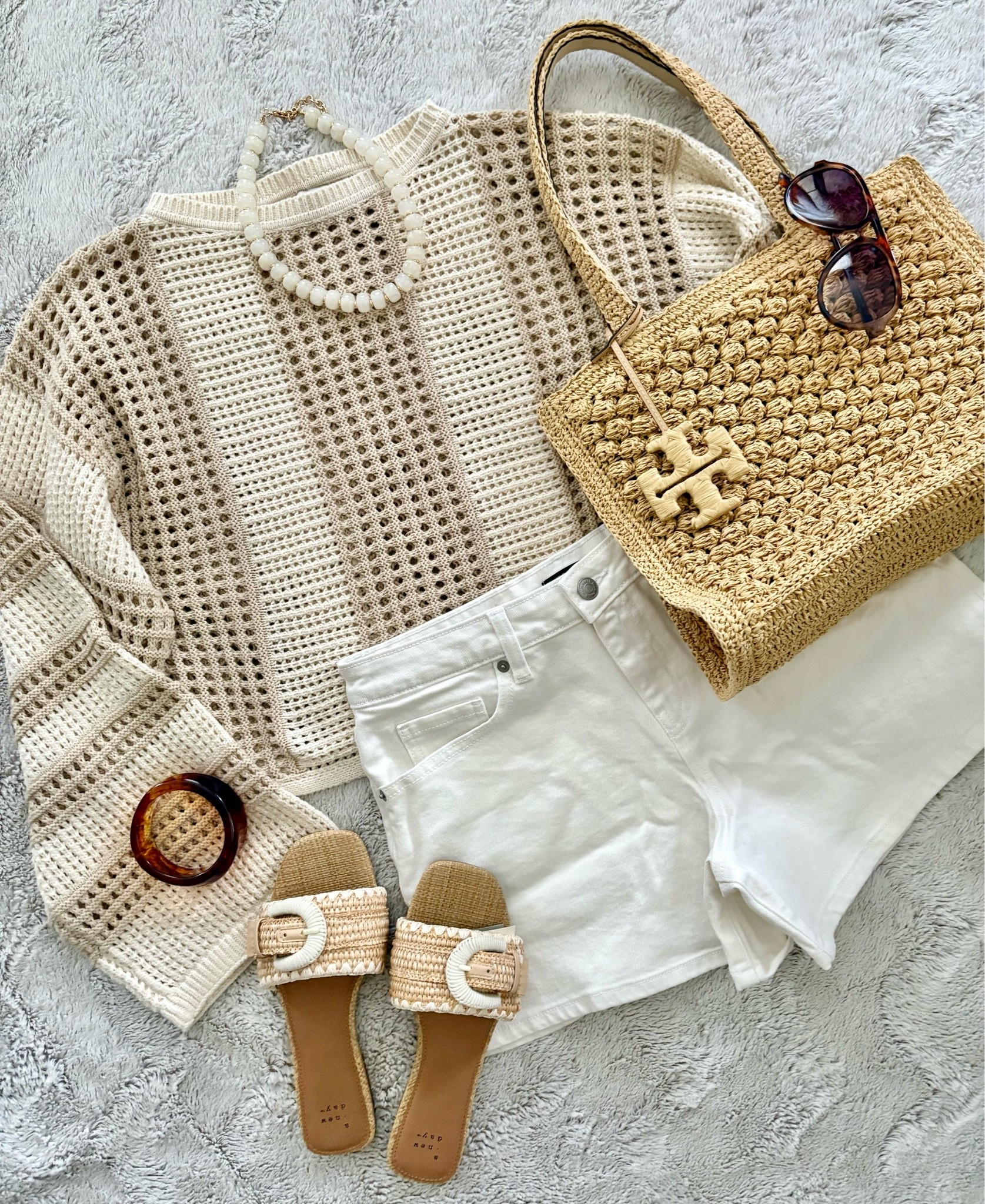 This crochet sweater looks high end! The flare sleeves are so cute! Great to throw over your shoulders for a night out too! 🫶🏼 These shorts fit so good! And this Tory Burch Tote is great for a day of shopping the farmers market or even heading to the pool! 
Sweater (xs, sleeves run long)
Shorts (size up, 6)
Sandals 20% OFF! (size up 1/2)