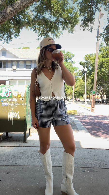 5/7/24 Boxer shorts outfit 🫶🏼 boxer shorts, navy blue boxer shorts, gingham boxer shorts, vest top, sweater vest, summer outfits, summer fashion, summer fashion trends, trucker hat outfits, cowgirl boots, dolce vita cowgirl boots, dolce vita boots

