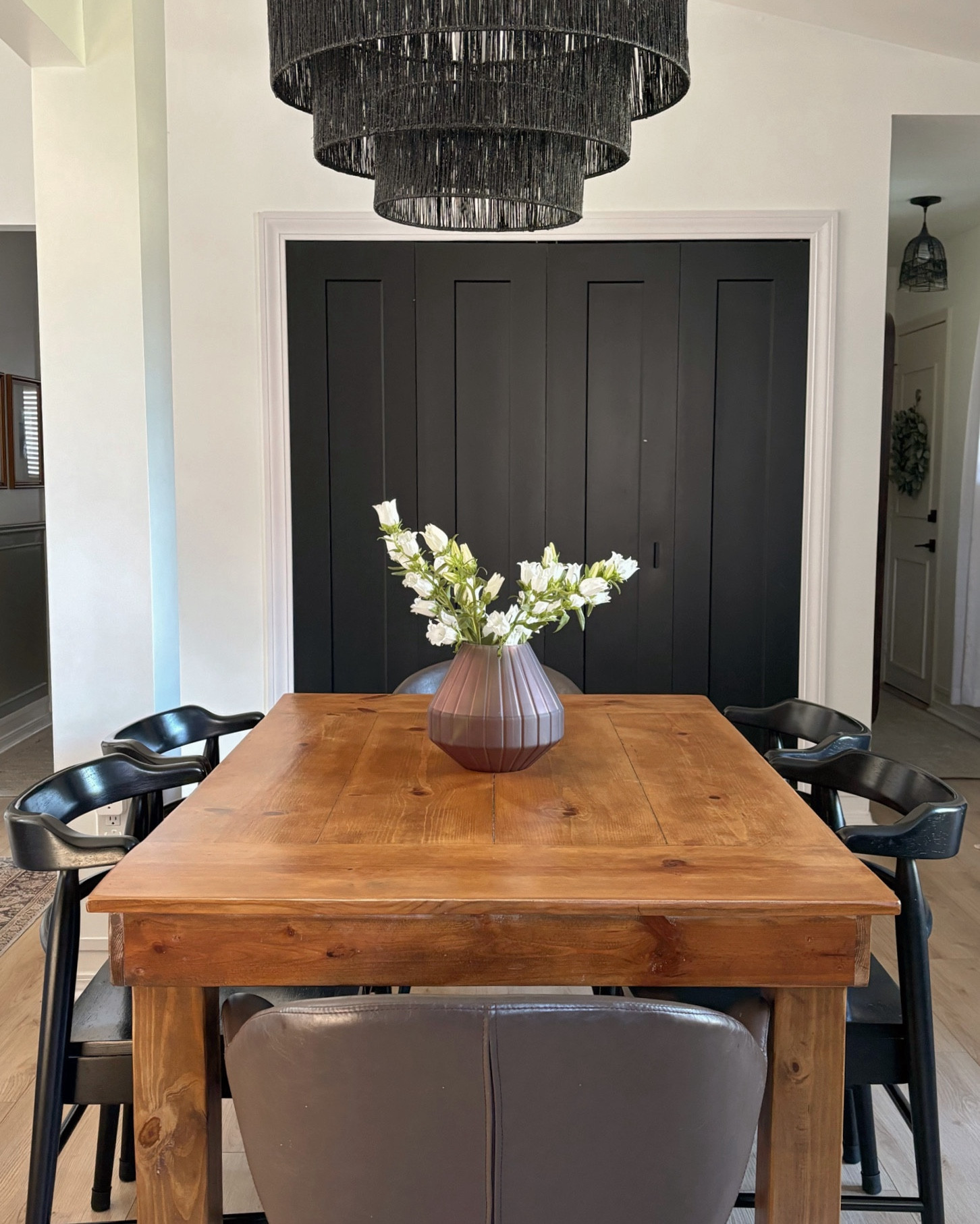 Mix and match dining table chairs for a more modern twist on a traditional dining set. These chairs have been able to withstand 3+ years of use from my family (3 kids, dog and cat)! They are affordable, practical and durable! Easy to wipe down and clean. 
The dining table was custom made, by me, to fit our space perfectly.

#LTKHome