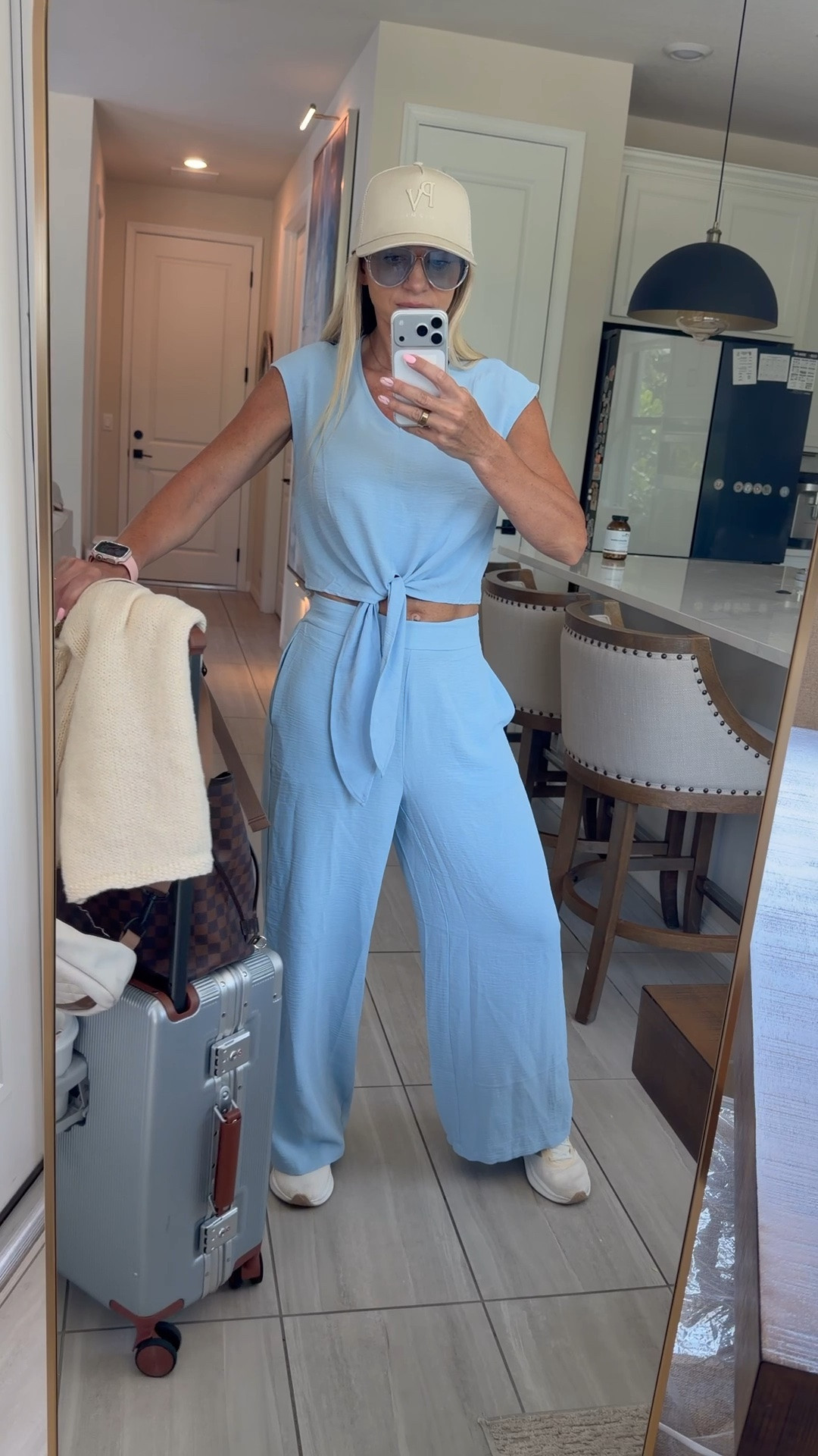 One of my favorite airport outfit formulas 🩵 A comfortable matching set, sneakers, a cap, and a backpack so my hands stay free while traveling. The blue makes it feel a little more styled without sacrificing comfort.
Wearing size M. 


airport outfit formula, blue airport outfit, matching lounge set, travel day outfit, comfy airport clothes, women’s travel set, airport sneakers outfit, casual travel fashion, airplane outfit, travel essentials

#LTKActive #LTKTravel #LTKootd