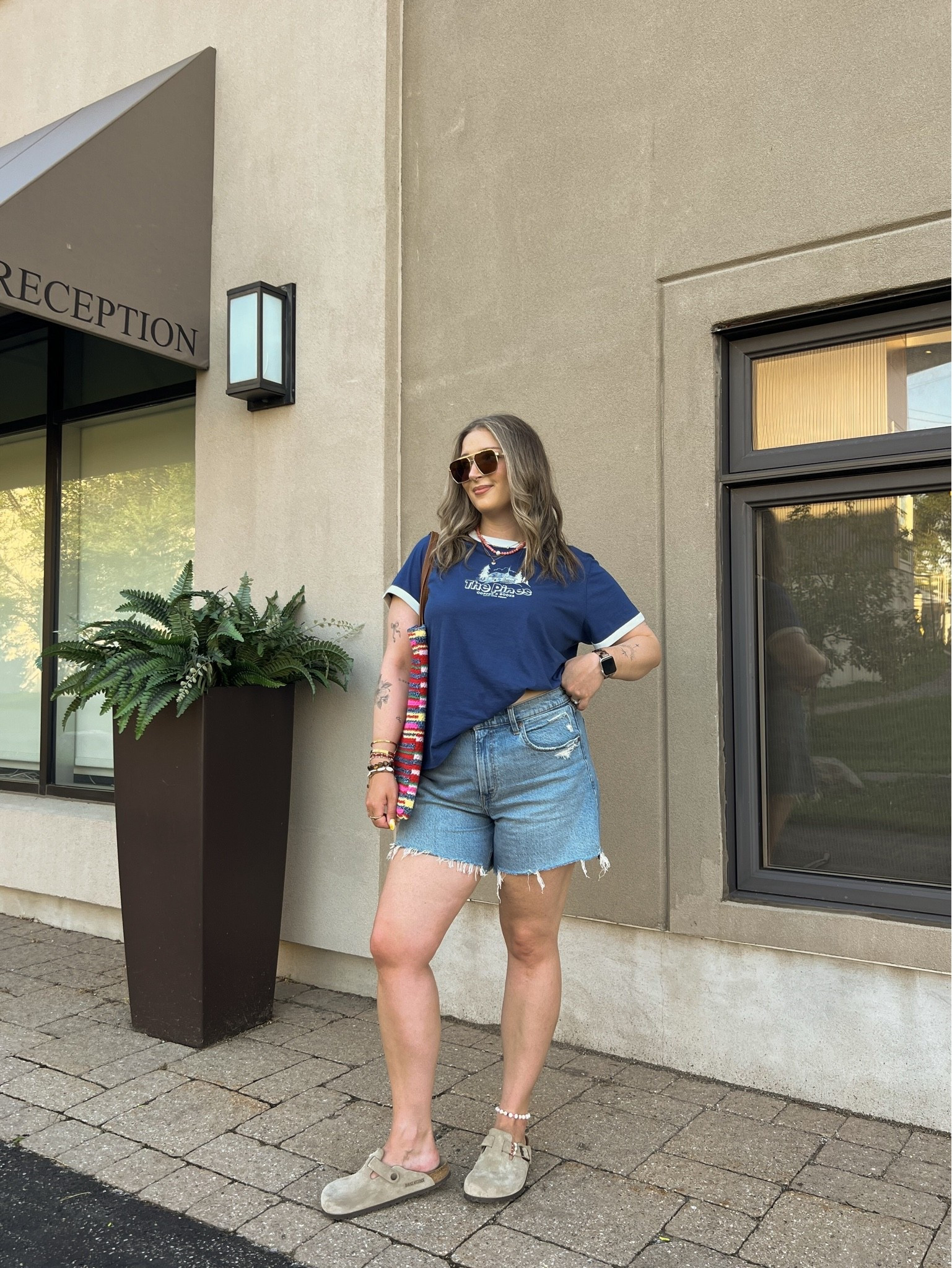 Casual summer outfit!! Sized up to XL in the graphic for an oversized fit. Canadian tee & tote bag links under “similar products”. Also sized up to 32 in the denim shorts for a loose fit. Birkenstock clogs are super comfy, I’m a 9.5-10 shoe and wear a 40.

#LTKsummer #LTKsale #LTKmidsize